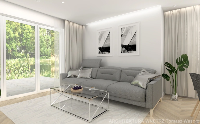 Nowoczesny salon z szarym narożnikiem, szklanym stolikiem i roślinami, minimalistyczny design.