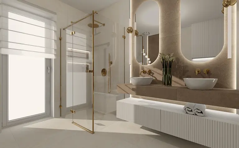 Wnętrze łazienki w stylu glamour i minimalistycznym z białymi umywalkami i złotymi akcentami.