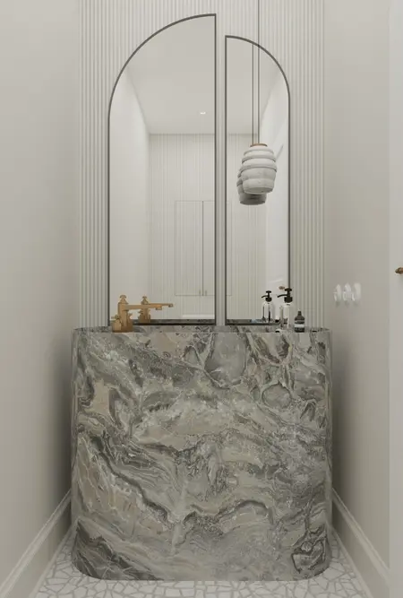 Wnętrze łazienki z marmurową umywalką i lustrami w stylu art deco i minimaluxe.