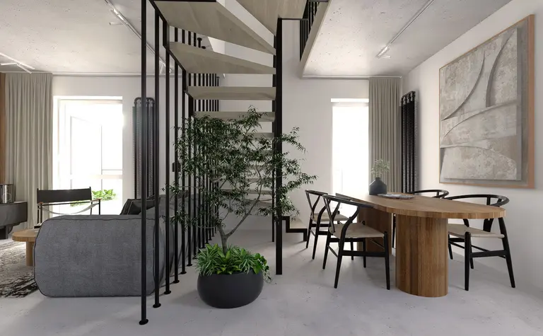 Wnętrze w stylu industrialnym z minimalistycznym stołem, roślinami i betonowym sufitem.