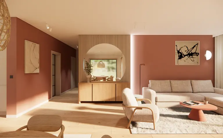 Salon w stylu boho i skandynawskim z beżową sofą i drewnianymi meblami.