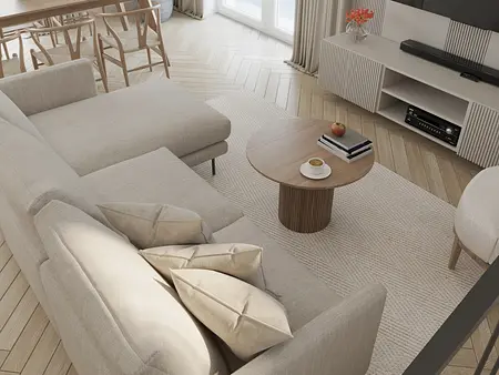 Wnętrze salonu w stylu minimalistycznym z beżową sofą i drewnianym stołem.