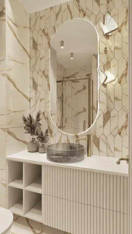Nowoczesna łazienka z beżowymi płytkami, elegancką umywalką i złotymi detalami.