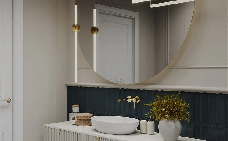 Wnętrze łazienki z białą umywalką, złotymi lampami i niebieską ścianą.