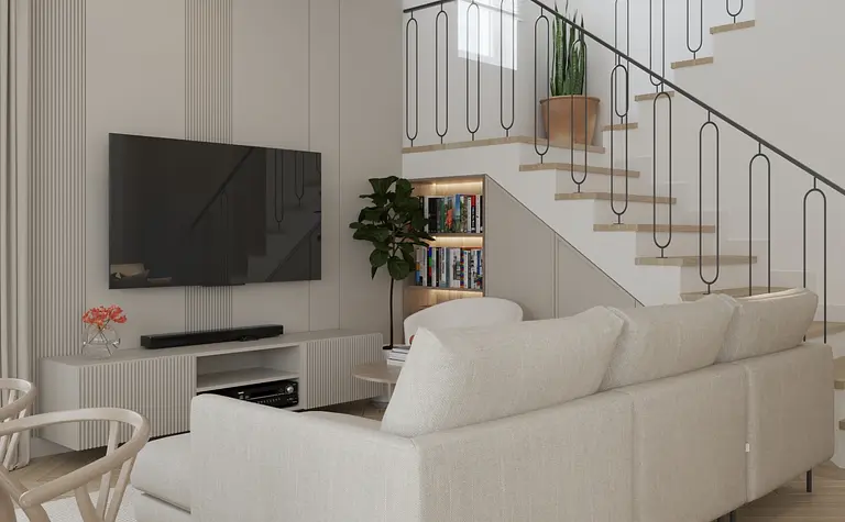 Wnętrze salonu w stylu minimalistycznym z białą sofą, nowoczesnym telewizorem i rośliną.