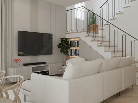 Wnętrze salonu w stylu minimalistycznym z białą sofą, nowoczesnym telewizorem i rośliną.