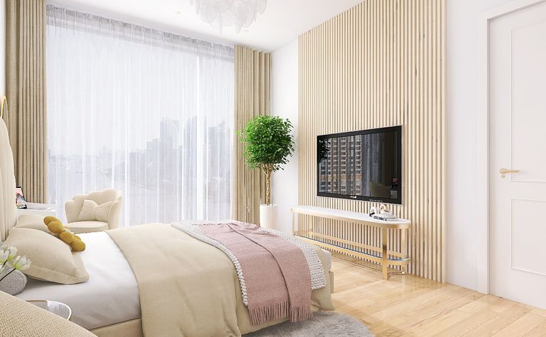 Wnętrze sypialni z elementami quiet luxury i współczesnymi meblami.