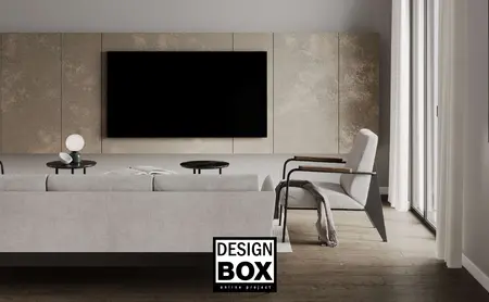 Wnętrze salonu w stylu minimalistycznym z szarym kanapą i drewnianymi detalami.