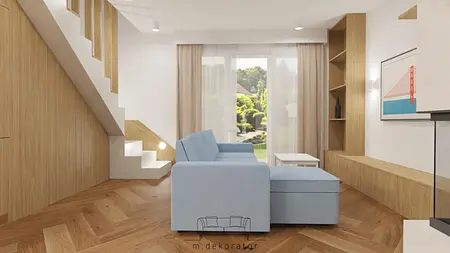 Wnętrze salonu w stylu boho, rustykalnym i skandynawskim z niebieską sofą i drewnianymi detalami.