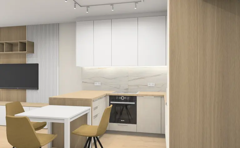 Wnętrze współczesnej kuchni z białymi meblami i drewnianymi detalami.