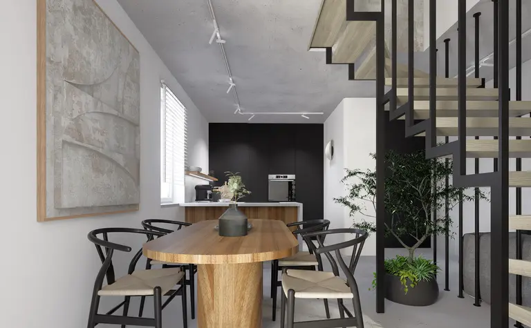 Jadalnia w stylu industrialnym i minimalistycznym z drewnianym stołem i czarnymi detalami.