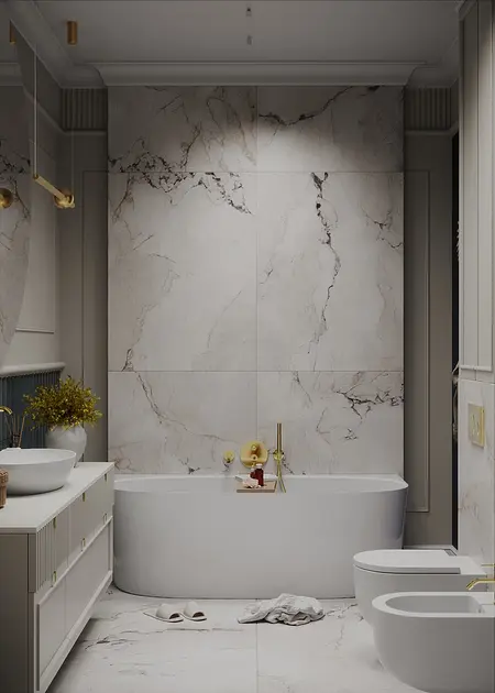 Wnętrze łazienki z marmurowymi ścianami i nowoczesnymi akcesoriami w stylu quiet luxury.