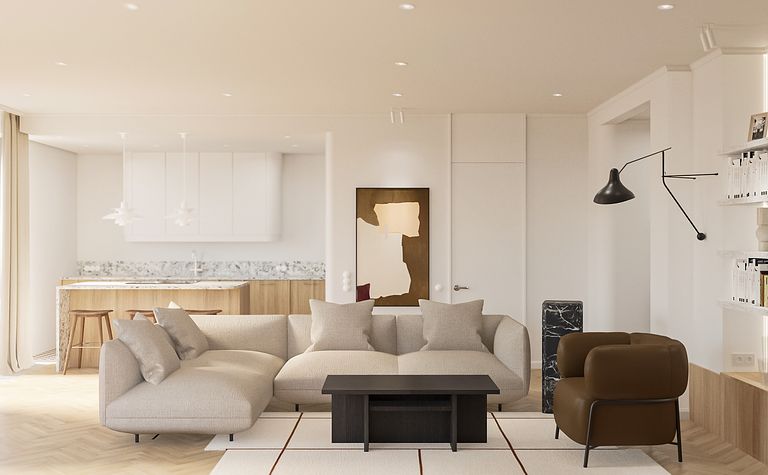 Wnętrze salonu z beżową sofą, drewnianym stołem oraz nowoczesnymi akcentami.