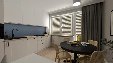 Kuchnia w stylu japandi z białymi meblami i niebieską ścianą.