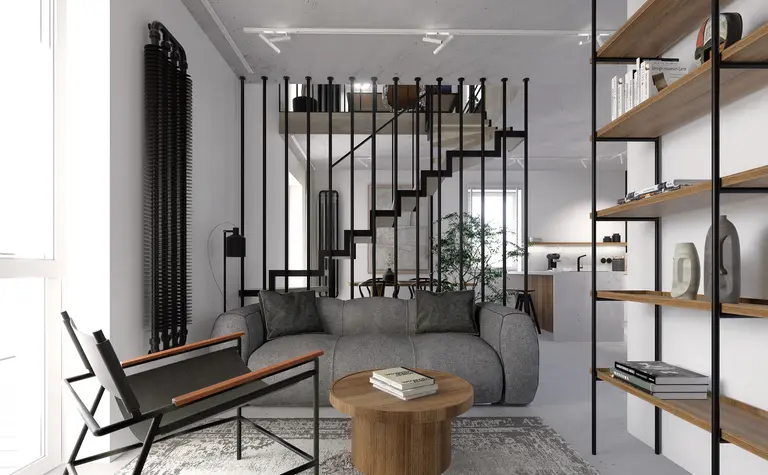 Wnętrze salonu z szarymi meblami, drewnianymi akcentami, styl industrialny i minimalistyczny.