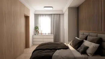 Wnętrze sypialni z nowoczesnym designem, drewnianą ścianą i białą komodą.