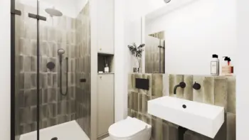 Wnętrze łazienki w stylu boho i minimalistycznym z szarymi kafelkami i białą umywalką.