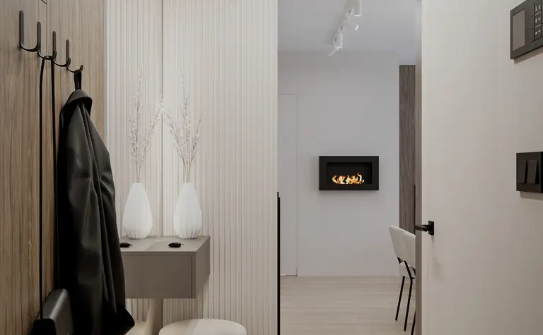Przedpokój w minimalistycznym stylu z elementami soft minimalizmu i współczesnymi akcentami.