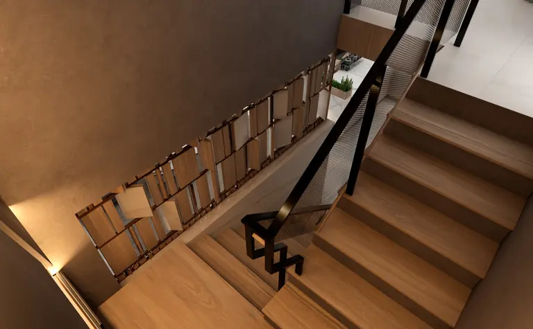 Wnętrze schodów z drewnianymi stopniami, szarymi ścianami i nowoczesnym balustradą.