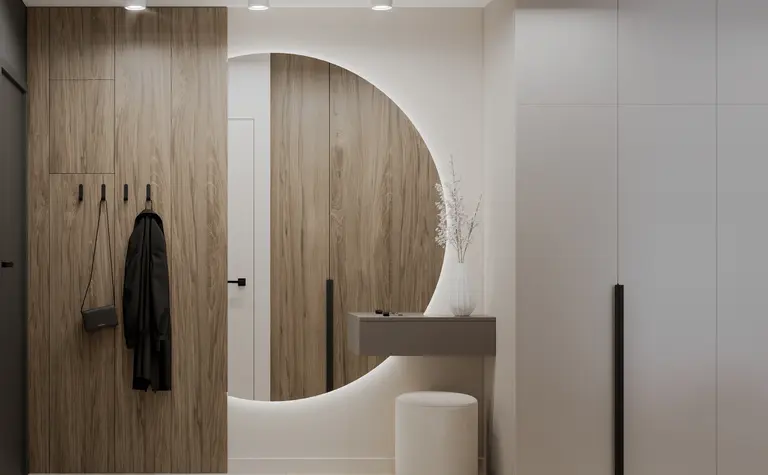 Nowoczesny przedpokój z minimalistycznym designem, drewnianymi elementami i białymi dekoracjami.