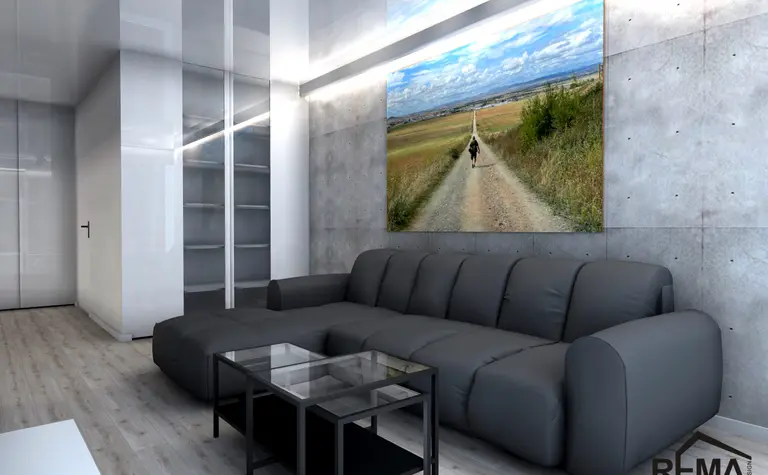 Wnętrze salonu w stylu industrialnym i minimalistycznym z szarymi ścianami i czarną sofą.