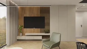 Wnętrze nowoczesnego salonu z drewnianą ścianą, telewizorem i rośliną.
