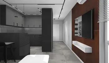Wnętrze kuchni z czarnymi meblami i szarym blatem, styl industrialny i minimalistyczny.