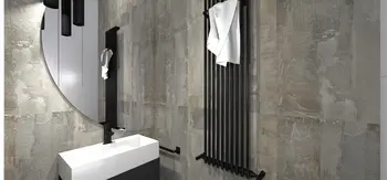 Wnętrze łazienki z białą umywalką, szarymi ścianami, akcentami industrialnymi i minimalistycznym stylem.