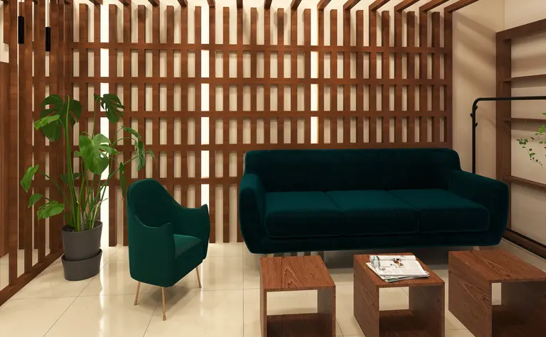 Eklektyczny salon z zieloną sofą, drewnianymi meblami i roślinnością.
