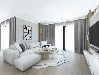 Wnętrze salonu w stylu japandi, minimalistycznym i nowoczesnym z białą sofą.