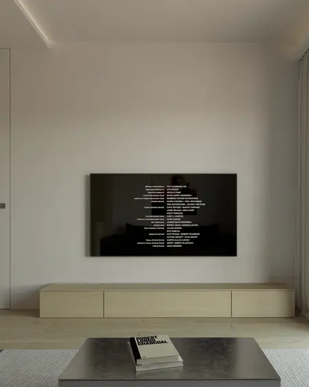 Minimalistyczny salon z nowoczesnym telewizorem i drewnianymi meblami.
