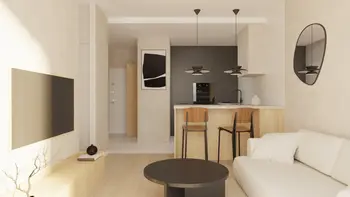 Wnętrze salonu w stylu japandi, minimalistycznym i współczesnym z jasnymi meblami.