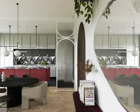 Wnętrze kuchni w stylu dopamine decor z czerwonymi meblami i marmurowym blatem.