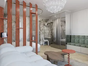 Wnętrze w stylu art deco i tradycyjnym z drewnianą ścianką i zieloną sofą.