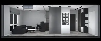Wnętrze salonu z czarną sofą, szarymi ścianami i nowoczesnymi elementami art deco i minimalistycznymi.