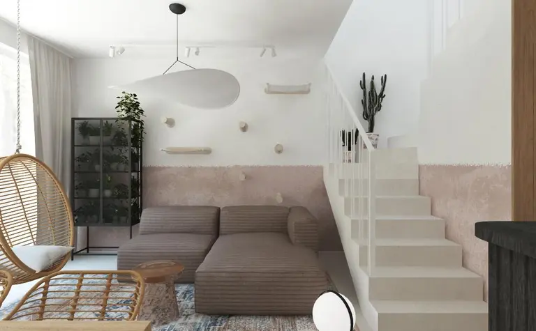 Wnętrze salonu w stylu boho i japandi z brązową sofą i roślinami.