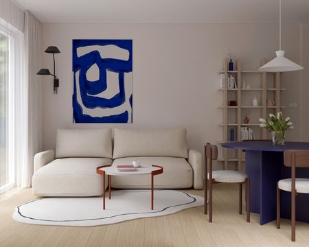 Wnętrze salonu w stylu japandi, minimalistycznym i skandynawskim z beżową sofą.