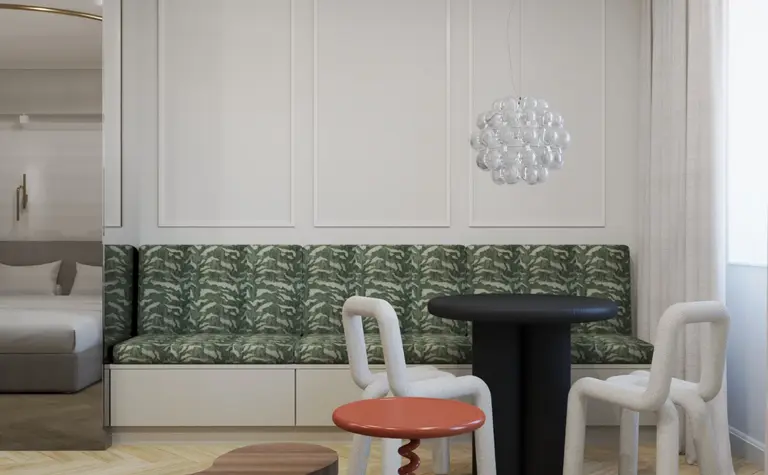 Wnętrze jadalni z zieloną kanapą, czarnym stołem i lampą w stylu art deco i tradycyjnym.