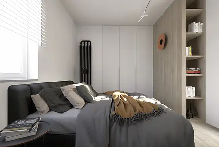 Sypialnia w stylu industrialnym i minimalistycznym z szarym łóżkiem i drewnianymi akcentami.