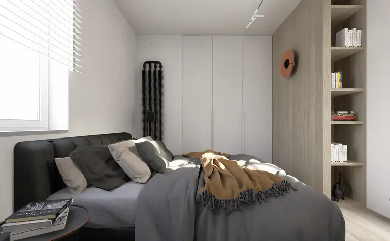 Sypialnia w stylu industrialnym i minimalistycznym z szarym łóżkiem i drewnianymi akcentami.