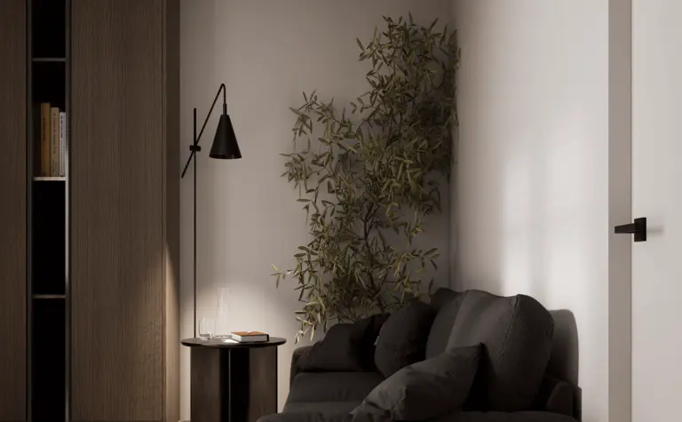 Wnętrze w stylu minimalistycznym z czarną sofą, drewnianymi meblami i roślinnością.