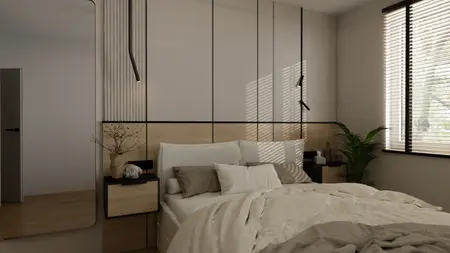 Wnętrze sypialni z minimalistycznym wystrojem, jasnymi meblami i drewnianą podłogą.