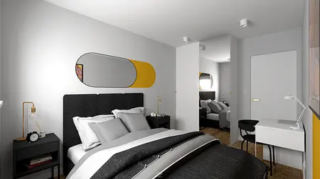 Sypialnia w stylu minimalistycznym z czarnym łóżkiem i szarymi detalami, rustykalne akcenty.