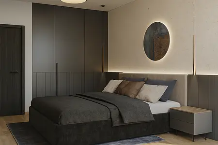 Sypialnia w stylu industrialnym i minimalistycznym z szarym łóżkiem i nowoczesnym oświetleniem.