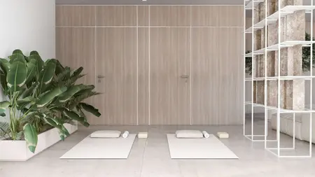 Wnętrze minimalistyczne w stylu japandi z matami do jogi i roślinami.