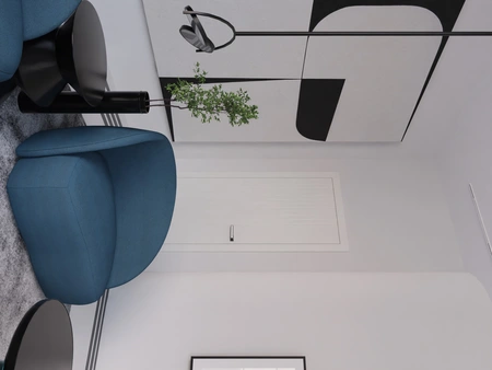 Nowoczesne wnętrze z fotelami w kolorze niebieskim, czarnym stolikiem i minimalistycznymi akcentami.