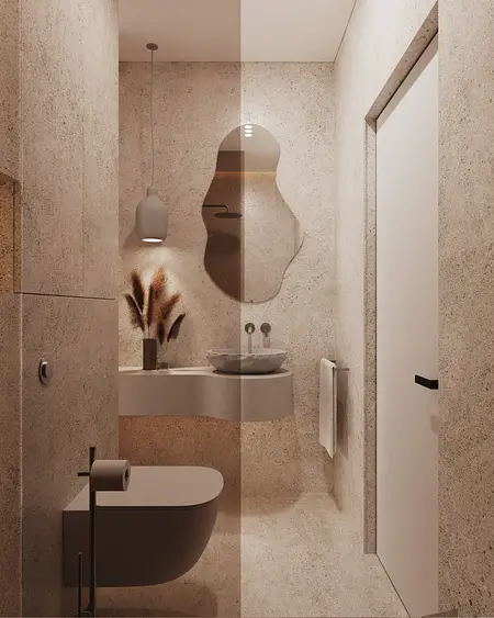 Minimalistyczna łazienka w stylu japandi z beżowymi ścianami i nowoczesnym lustrem.