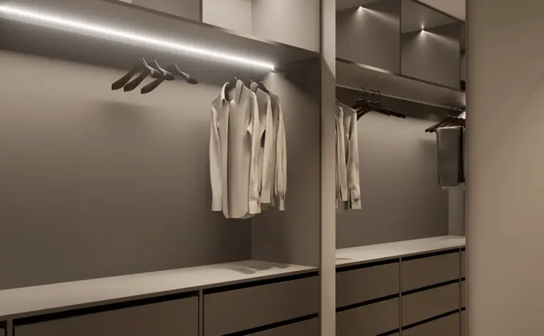 Garderoba z minimalistycznym designem, nowoczesnymi meblami i oświetleniem.