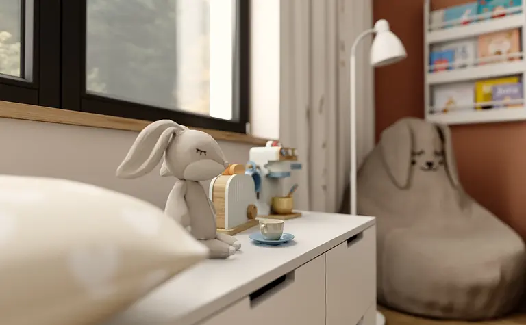 Wnętrze pokoju dziecięcego z pluszowym królikiem i zabawkami.