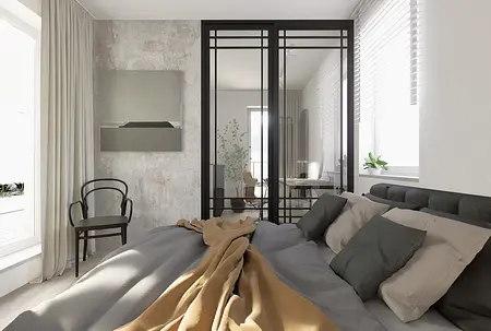 Sypialnia w stylu industrialnym z minimalistycznym łóżkiem i biurkiem.
